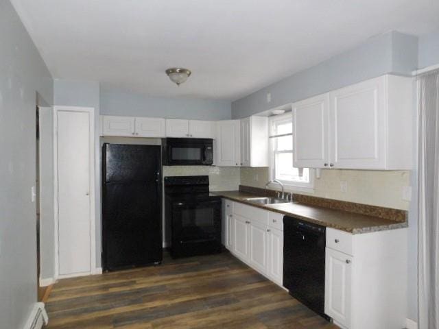 kitchen with a baseboard heating unit, black appliances, sink, dark hardwood / wood-style floors, and white cabinetry