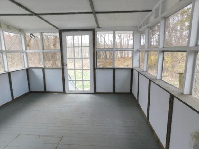 unfurnished sunroom featuring plenty of natural light