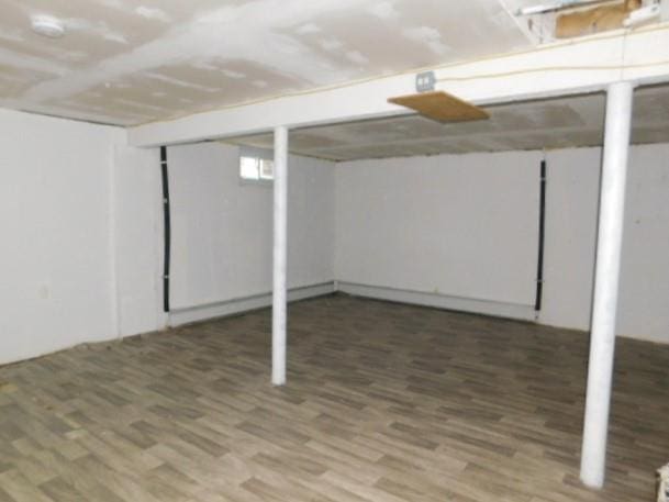 basement featuring dark wood-type flooring