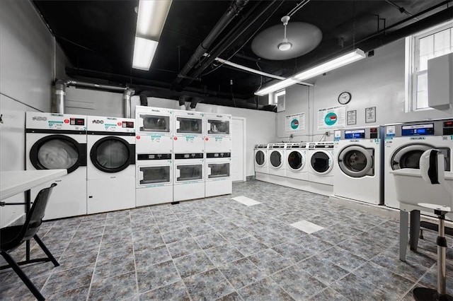 community laundry room featuring washer and clothes dryer