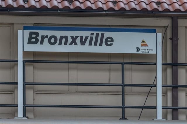 exterior details with a tile roof