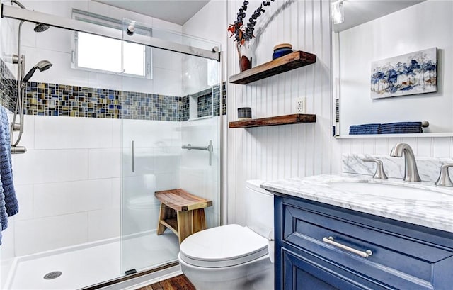 bathroom featuring hardwood / wood-style floors, vanity, an enclosed shower, and toilet