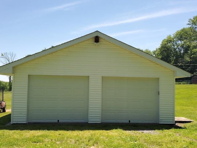 garage with a yard