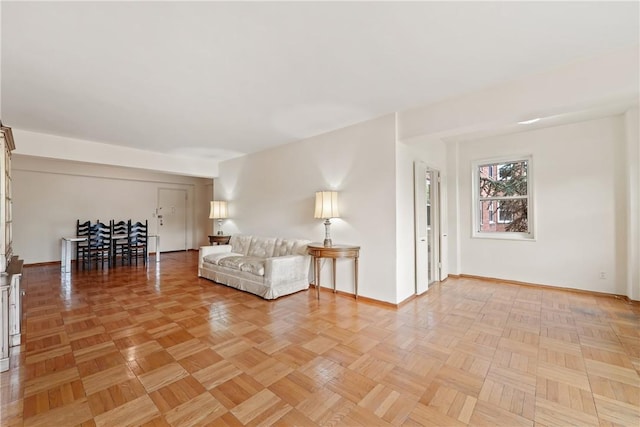 unfurnished living room with light parquet flooring