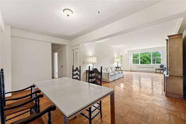 dining room with radiator and light parquet flooring