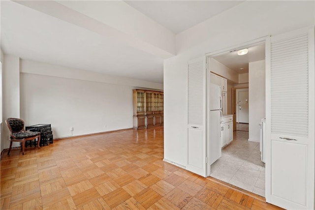 spare room with light parquet floors