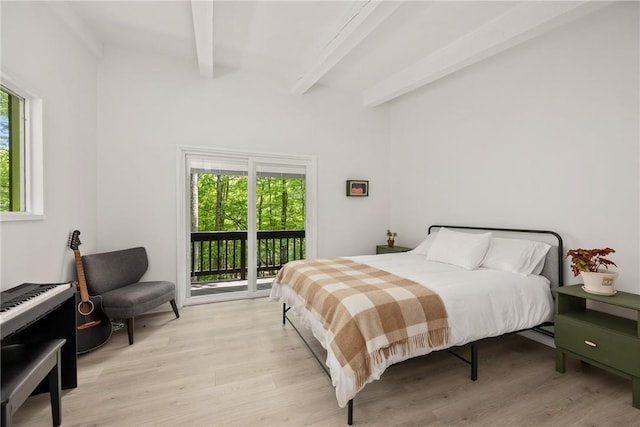 bedroom with beamed ceiling, light hardwood / wood-style floors, access to outside, and multiple windows