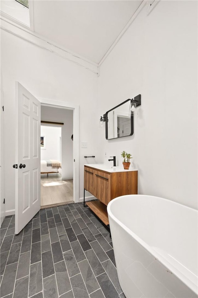 bathroom with vanity and a tub to relax in