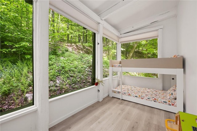 unfurnished sunroom with lofted ceiling