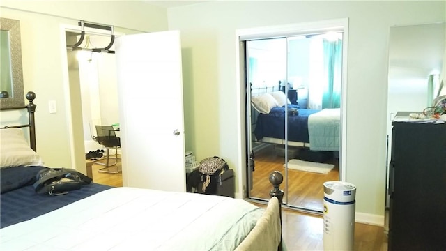 bedroom featuring hardwood / wood-style flooring and a closet