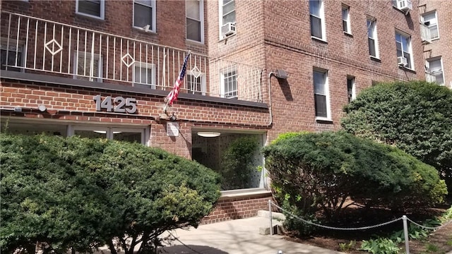 view of property featuring a wall mounted AC