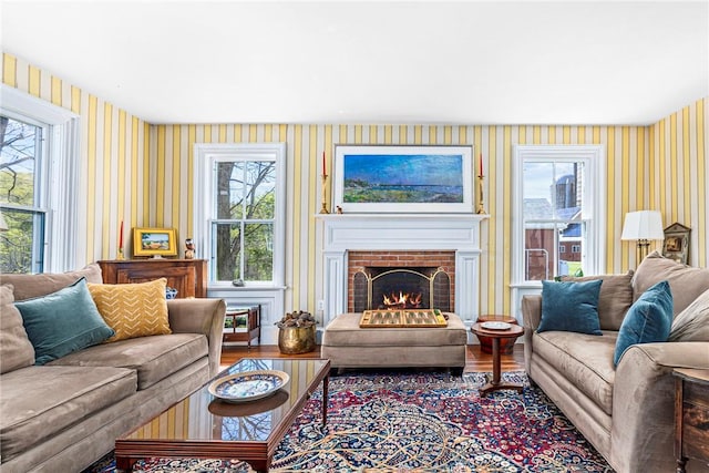 living room featuring hardwood / wood-style floors, plenty of natural light, and a fireplace