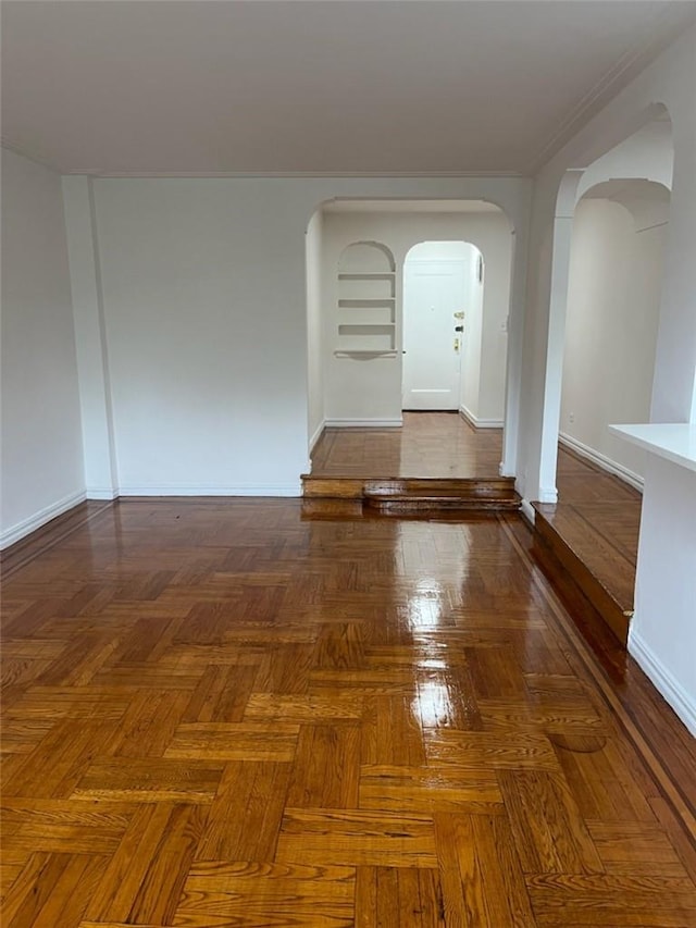 empty room with dark parquet floors