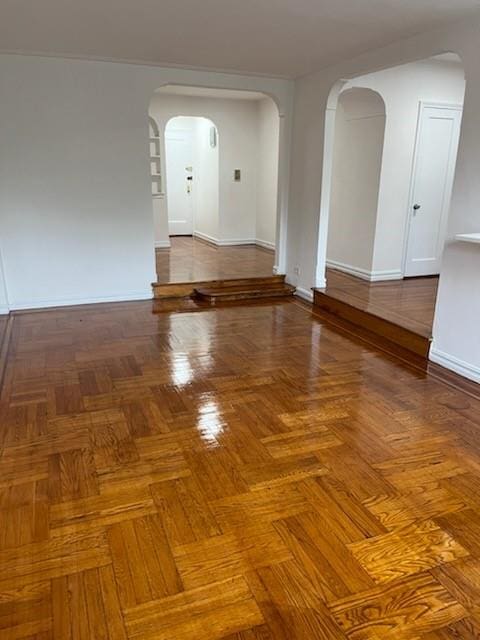 spare room featuring parquet floors