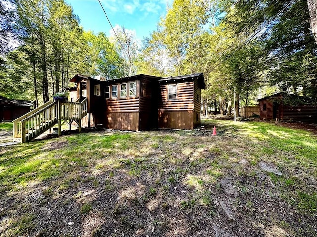 rear view of house with a lawn