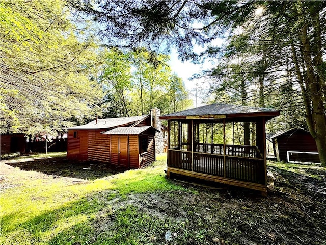 rear view of house featuring a gazebo