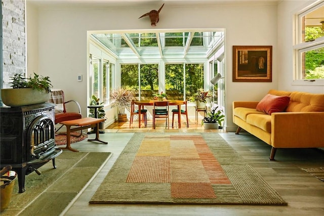 sunroom / solarium with a wood stove