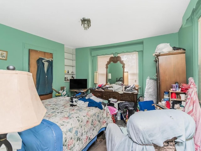 bedroom featuring carpet and a closet