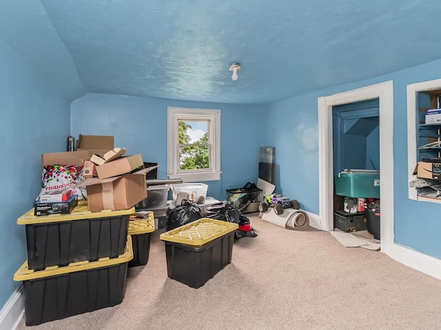 game room featuring carpet and lofted ceiling