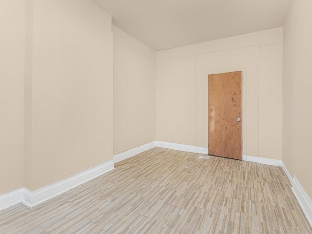 spare room with light wood-type flooring