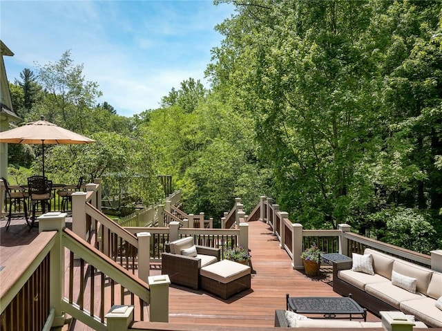 wooden deck with an outdoor living space