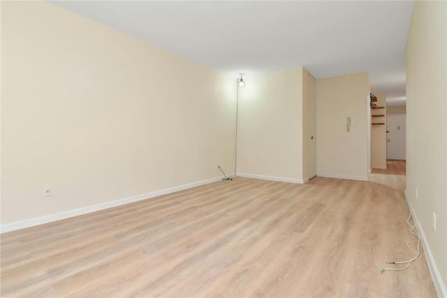 spare room featuring light hardwood / wood-style flooring