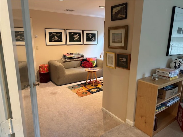 interior space with light carpet and ornamental molding