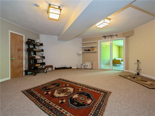 interior space with carpet floors and a textured ceiling