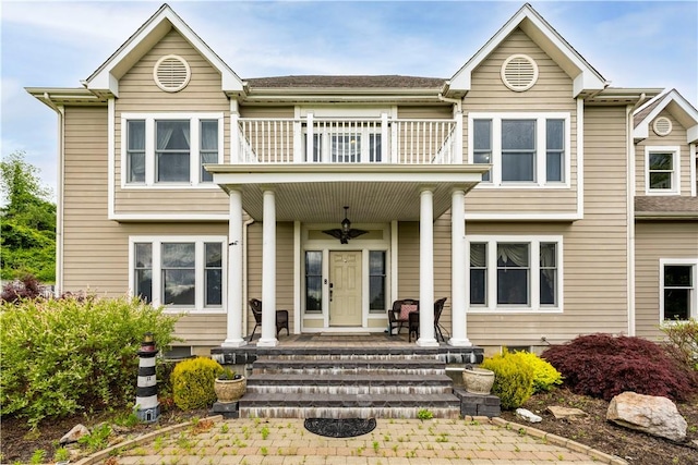 view of front facade featuring a porch and a balcony