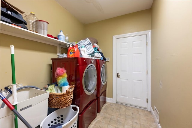 washroom with separate washer and dryer and sink