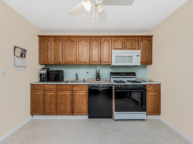 kitchen with dishwasher, backsplash, sink, ceiling fan, and gas stove