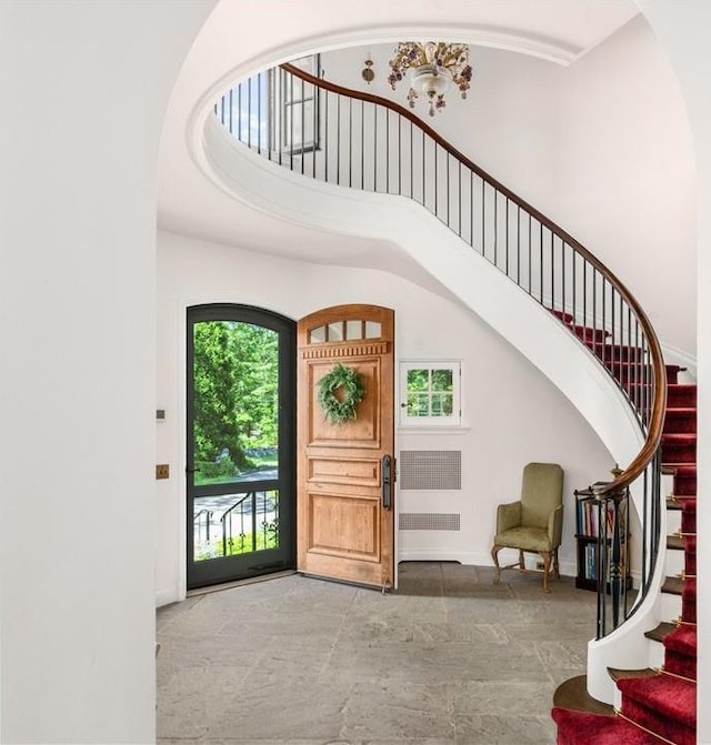 entrance foyer with a towering ceiling