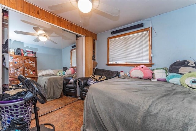 bedroom featuring ceiling fan, a closet, and carpet floors