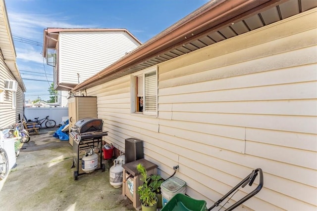 view of side of home with a patio