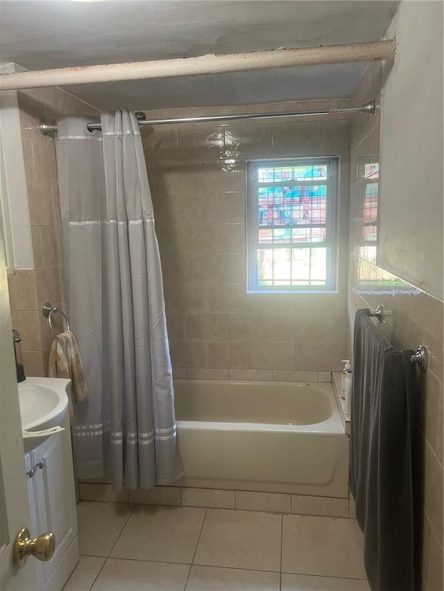 bathroom featuring tile patterned flooring, shower / bath combo, and vanity