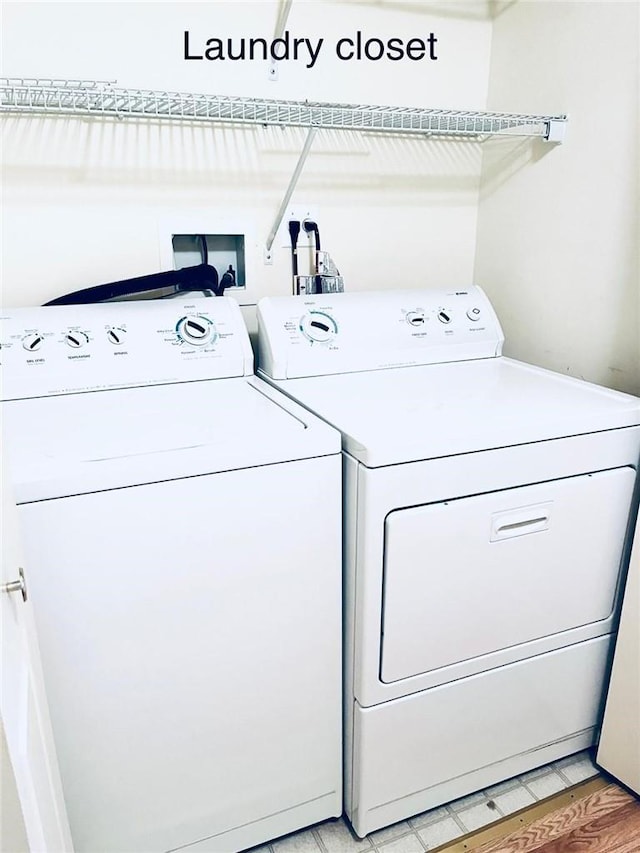 washroom featuring light hardwood / wood-style flooring and independent washer and dryer