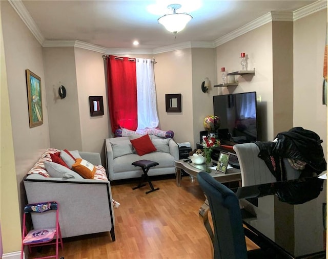 living room with light hardwood / wood-style floors and ornamental molding