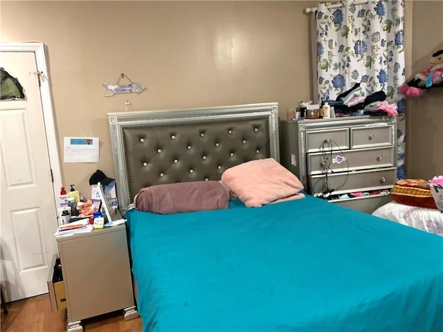 bedroom featuring hardwood / wood-style floors