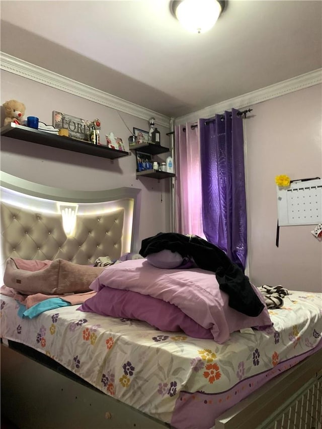 bedroom featuring ornamental molding