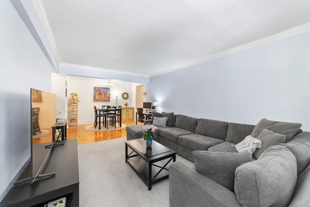 living room featuring hardwood / wood-style flooring and crown molding