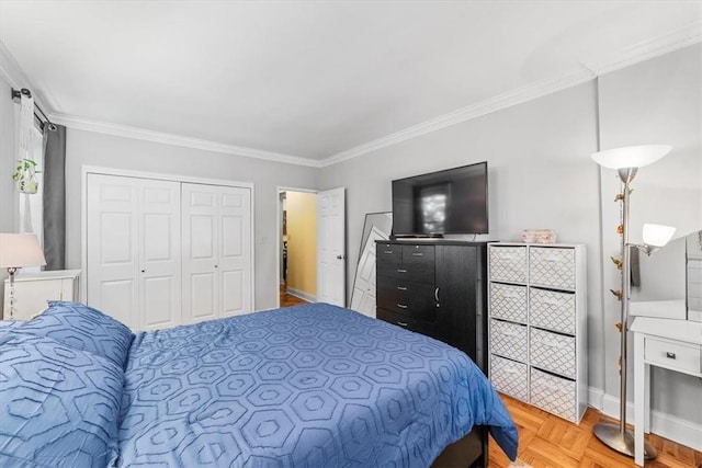 bedroom with crown molding, a closet, and light parquet flooring