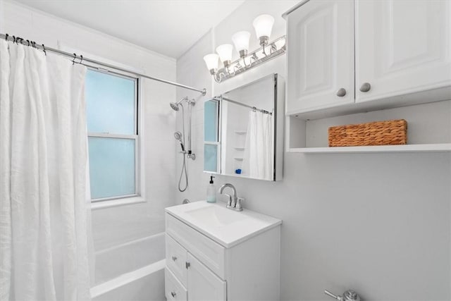 bathroom featuring shower / tub combo and vanity