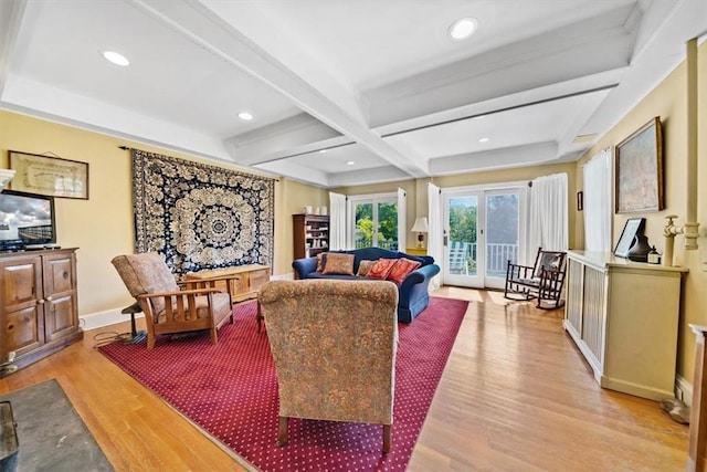 living room featuring french doors, light hardwood / wood-style flooring, coffered ceiling, and beam ceiling