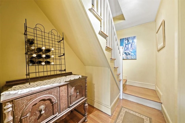 stairs with hardwood / wood-style flooring