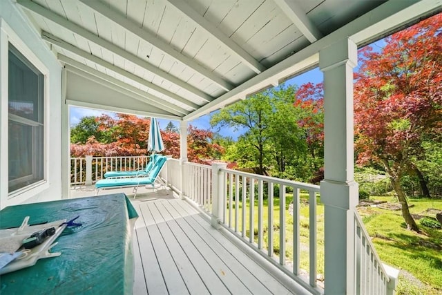 wooden terrace featuring covered porch