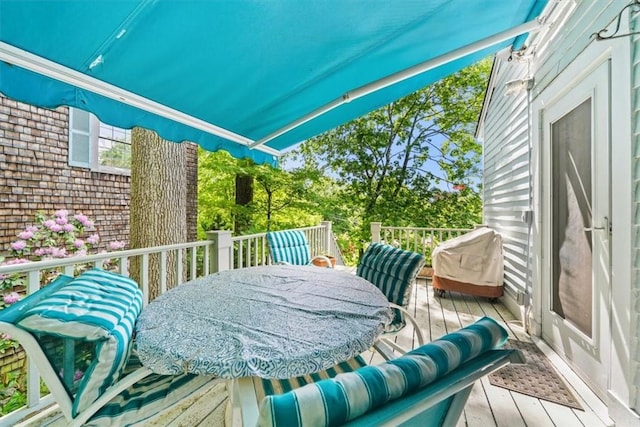 wooden deck with grilling area