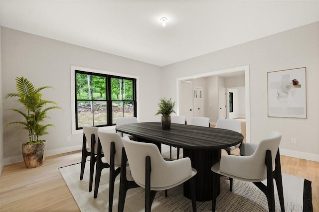 dining area with light hardwood / wood-style flooring