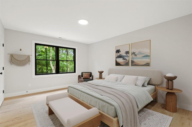 bedroom with light wood-type flooring