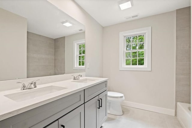 bathroom with tile patterned floors, vanity, and toilet