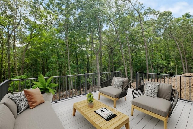 wooden terrace with an outdoor living space